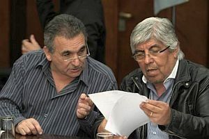 Juan Carlos Schmid y Hugo Moyano.