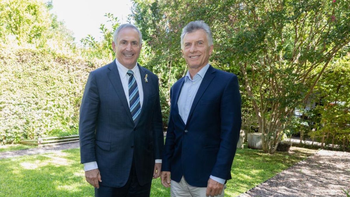Marc Stanley y Mauricio Macri.