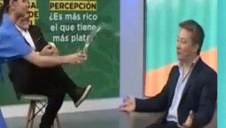 Tensión al aire de LN+: Una panelista de Julián Weich le tiró un vaso con agua en la cara a otro