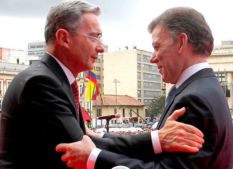 Álvaro Uribe y Juan Manuel Santos.